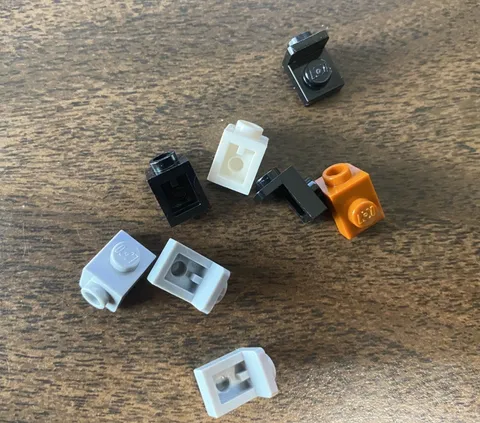LEGO Parts: 36841 Bracket 1x1 by 1x1 Lot of 12, Black Gray White Dk Orange