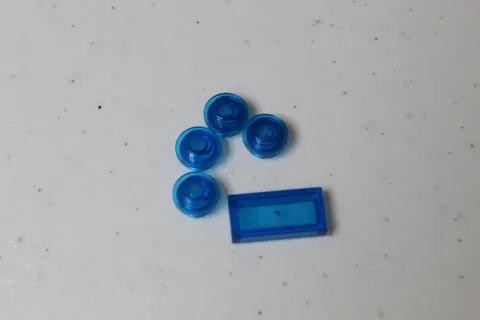(4) Lego 1x1 Round Plate and 1 flat 1x2 - both Transparent Blue