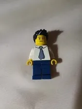 LEGO minifigure appears to be the "Reporter" character from the LEGO City Space 