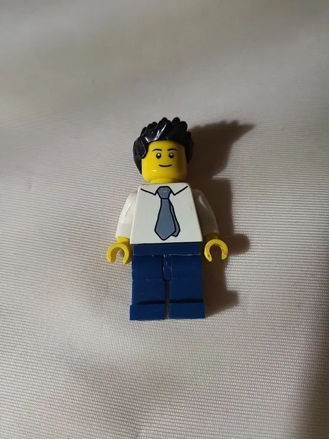 LEGO minifigure appears to be the "Reporter" character from the LEGO City Space 