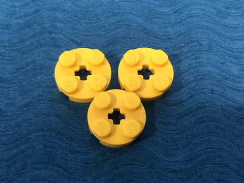 LEGO PART 4032 2X2 ROUND PLATE WITH AXLE HOSE 3 PIECES (YELLOW)