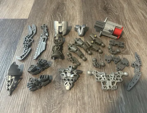 LEGO BIONICLE Parts Lot Gray/Dark Gray/Silver/Red Weapons Armor Connectors lot 1