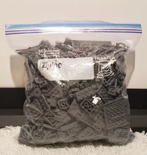 Legos Dark Gray, 1 big bag, 1 small half filled bag.