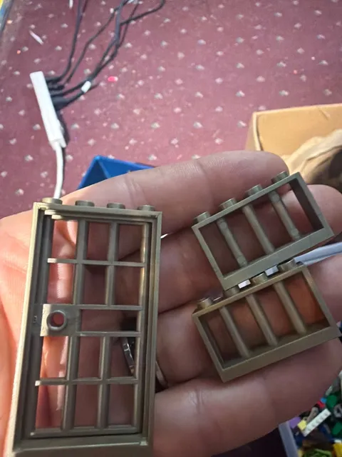Lego Door Frames gold in color and 2 windows