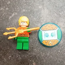LEGO Plastic Minifigure w/ Gold Trident & Round Tile Accessory