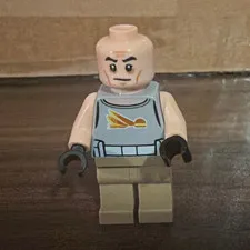 LEGO Minifigure Bald Male Light Blue Torso Yellow Design Tan Legs Black Hands