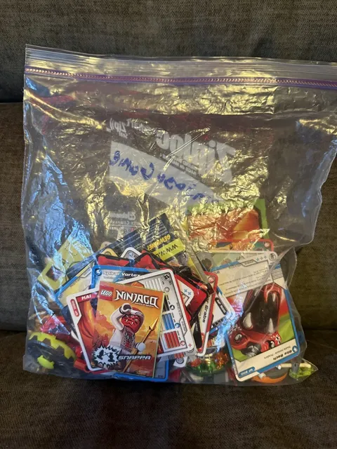 LEGO Ninjago Spinjutzu Card Game Pack with minifigs, cards, ring, and manuals