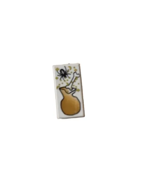 LEGO Tile 1 x 2 with Black Spider, White Bone and Brown Bag Pattern inv.477