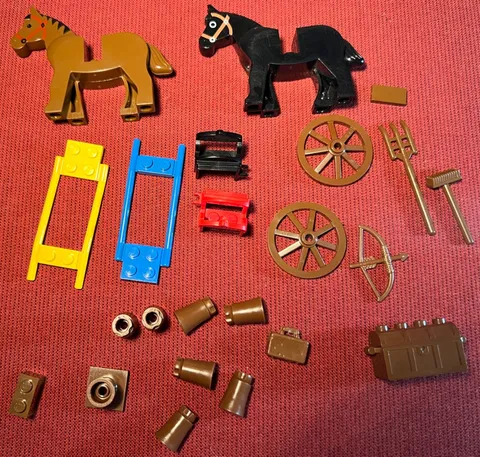 Lego lot of 23 horse related items: 2 horses, saddles, harnesses, wheels, chest