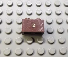 LEGO Reddish Brown 1x2 Brick with Gold 2 10194 Emerald night Sticker