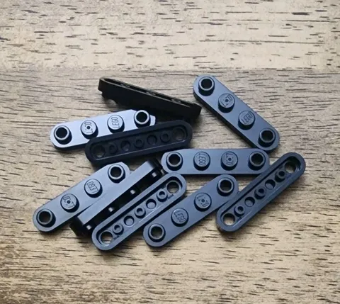 LEGO Black Plate, Round 1 x 4 with 2 Open Studs. QTY 10. Part 77845