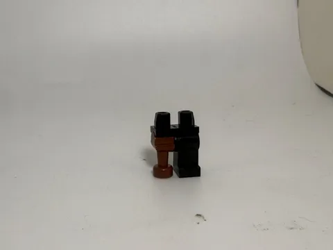 Lego Leg-Hips and 1 Black Left Leg, 1 Brown Pirate Peg Leg