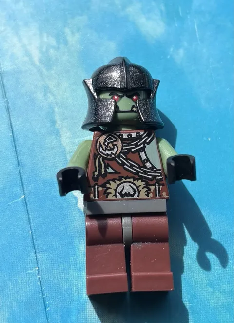 LEGO Minifigure Orc/Troll Style - Green Head, Black Helmet, Brown Legs